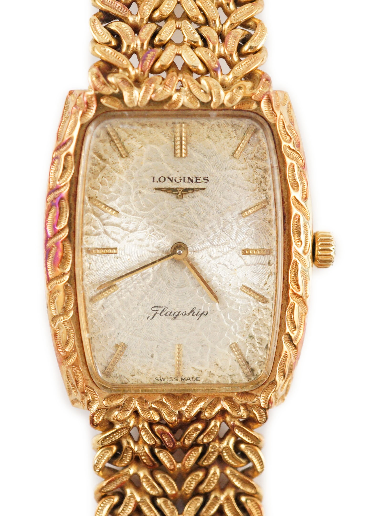 A gentleman's 1980's 18ct gold Longines Flagship manual wind tonneau shaped dress wrist watch